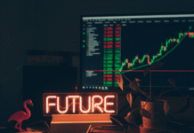 How to Make Your Investment Portfolio Work for You Dim desk with burnt neon and stock screen.