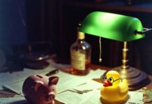 What You Need to Know About Tax-Efficient Withdrawal Strategies Rubber duck judges tax mess under green lamp.